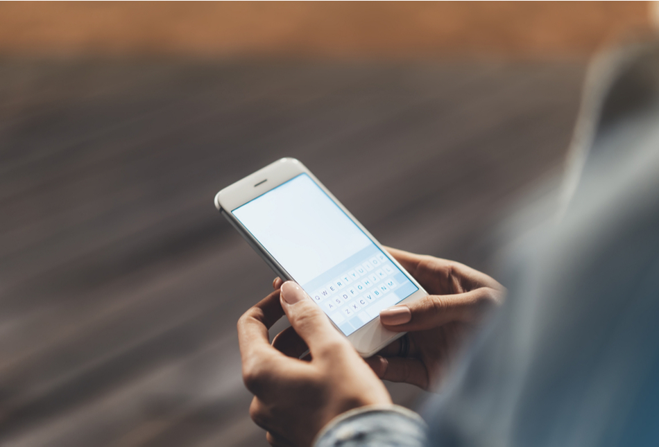 Close up of a woman holding a smartphone