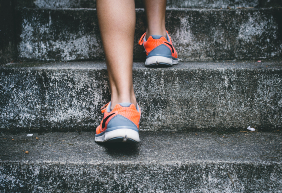 Close-up of someone walking up some steps