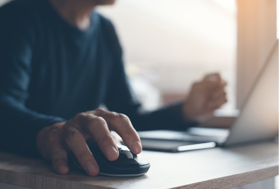 A man working on a laptop.