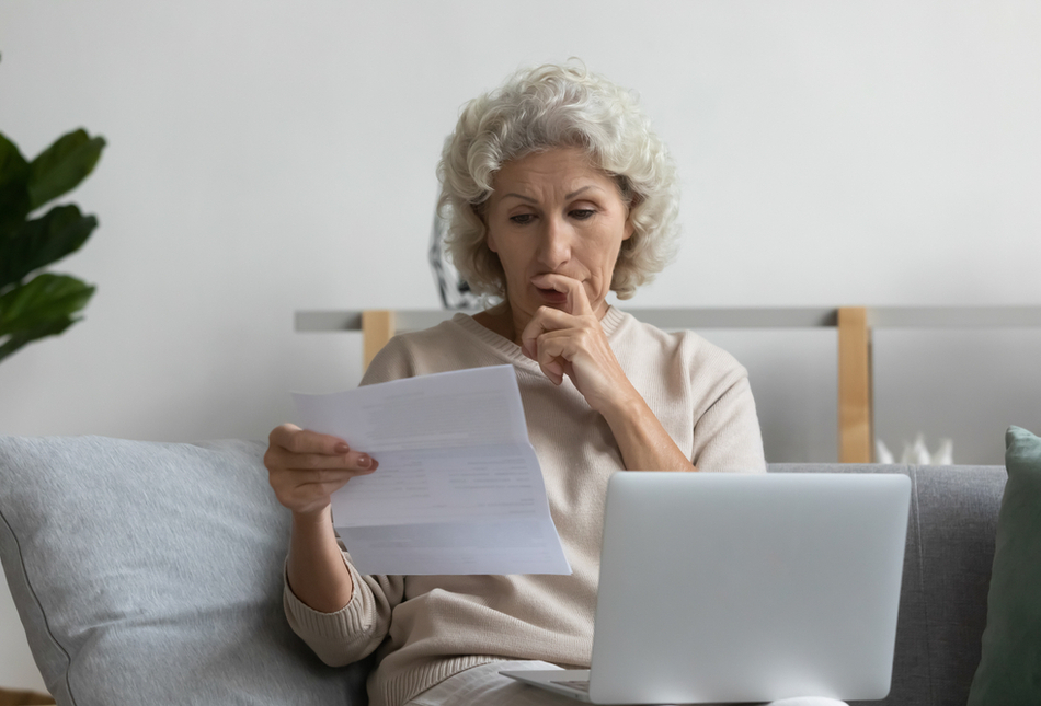 A woman looking at some paperwork.