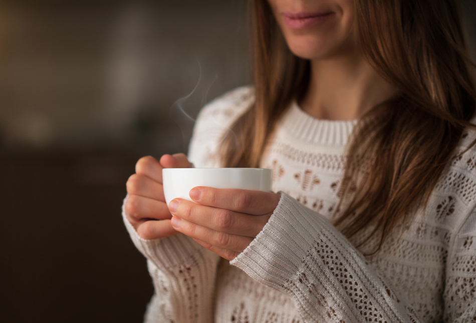 A woman relaxing with a cup of tea.