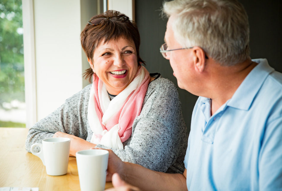 A couple talking over a coffee.