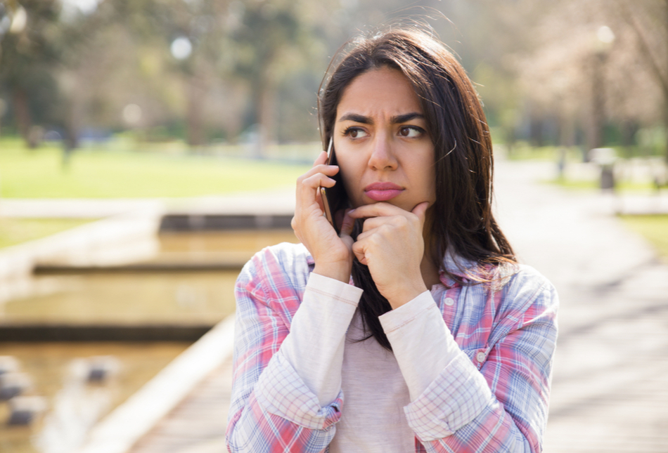 Lady looking concerned about a phone call