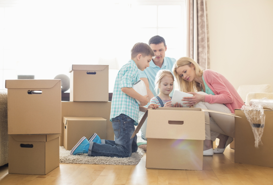 A family unpacking boxes in a new home.