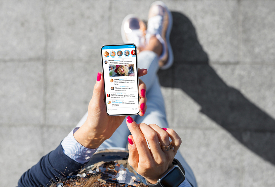 A woman using social media on her phone.