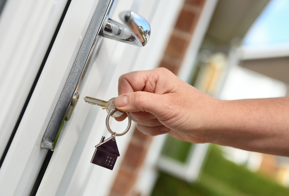 Someone unlocking their front door.