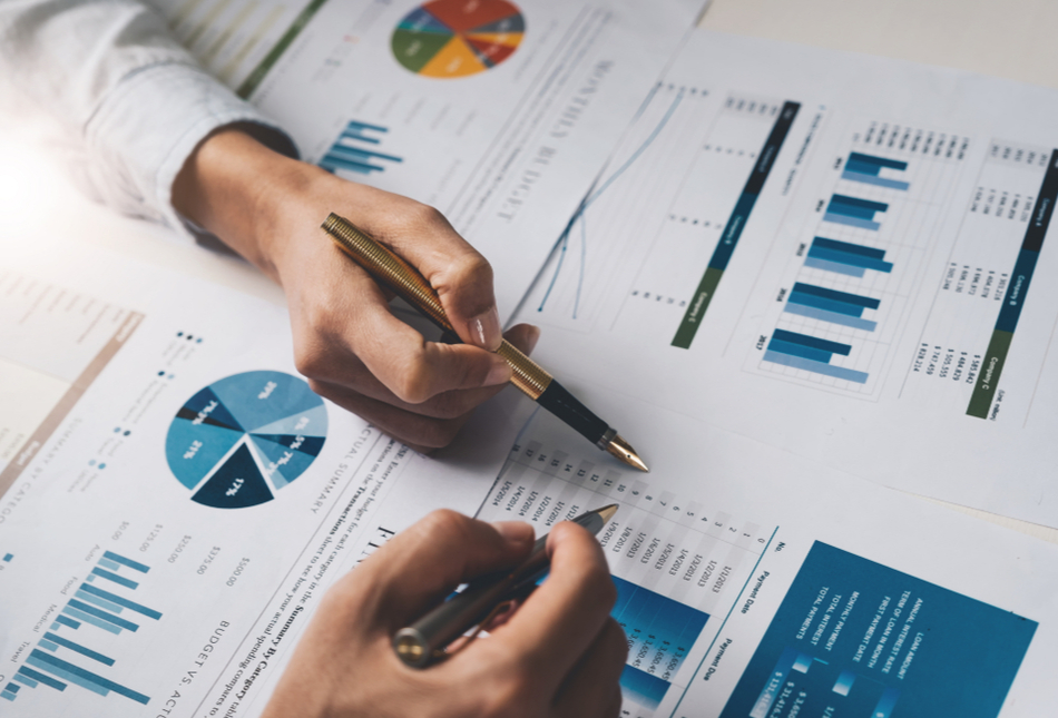Two people looking at financial documents.