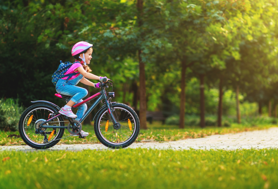 A girl riding a bike.