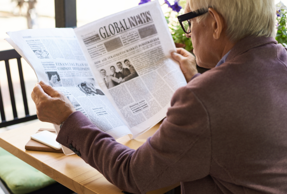 A man reading a newspaper.