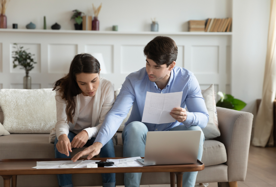 Couple reviewing finances at home