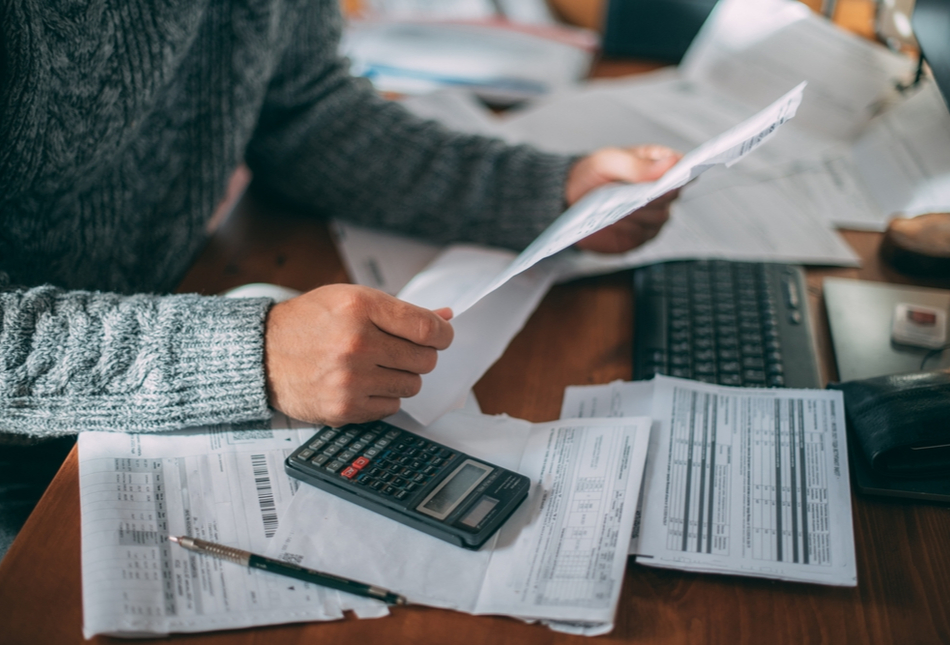 A man looking at some paperwork.