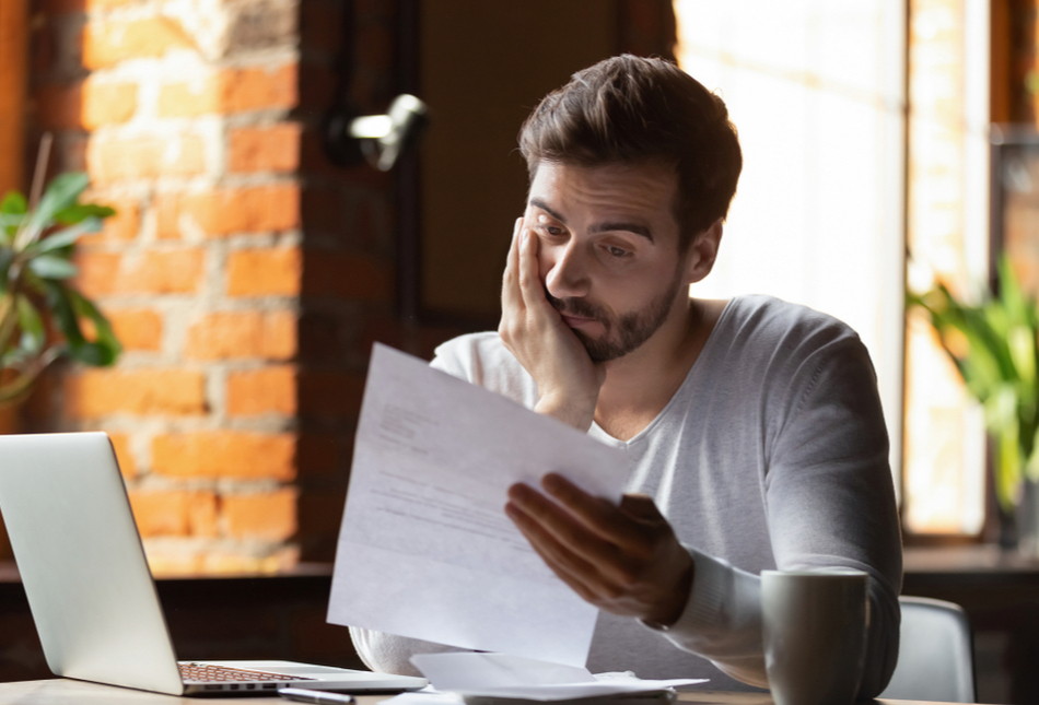 A man reading a letter.