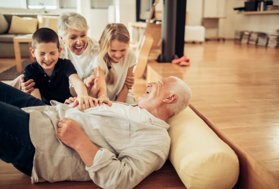 Grandparents playing with their grandchildren.