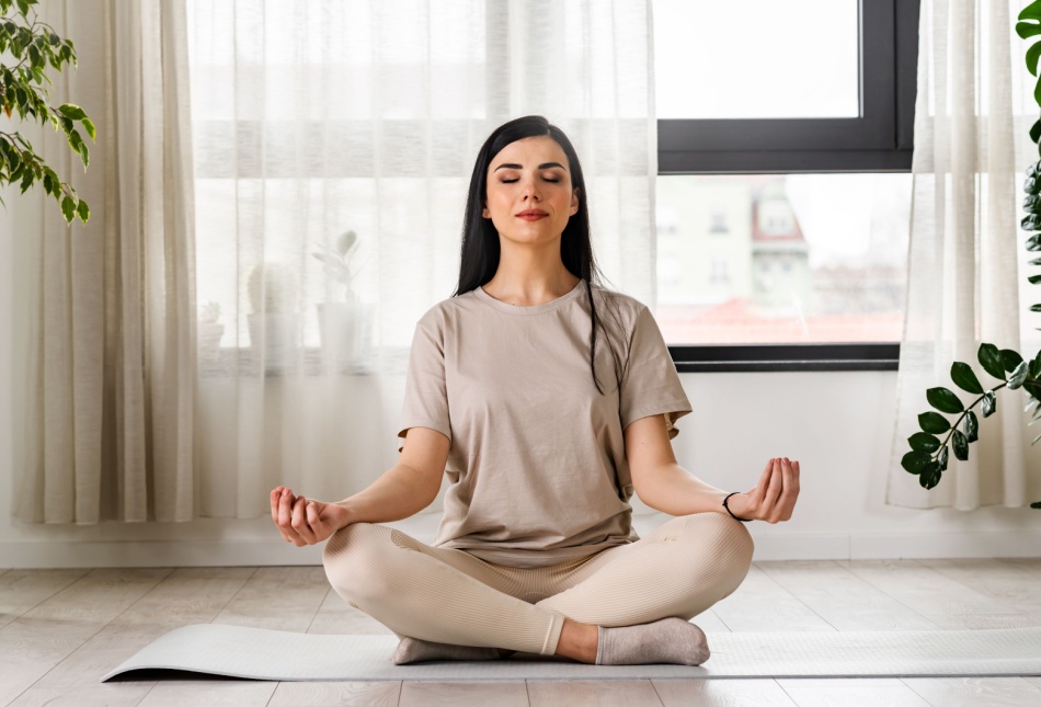 A woman meditating.