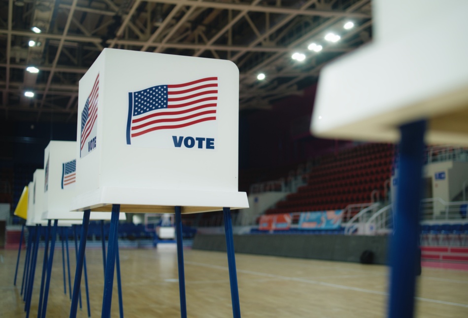 A voting booth with an American flag.