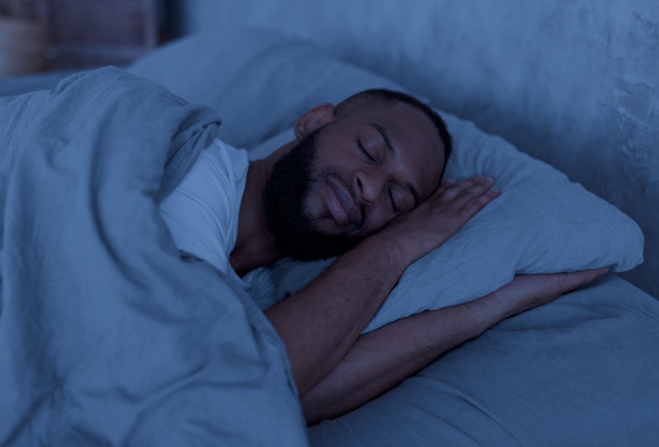 Man asleep in bed.