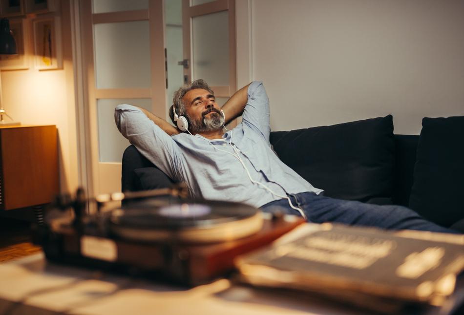 A man relaxing while listening to music.