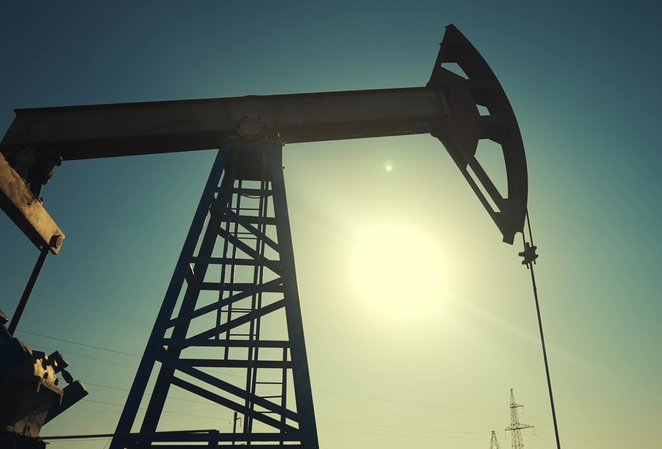 A silhouette of an oil pump.